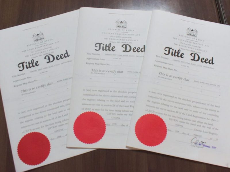 Kenyan title deeds on a desk